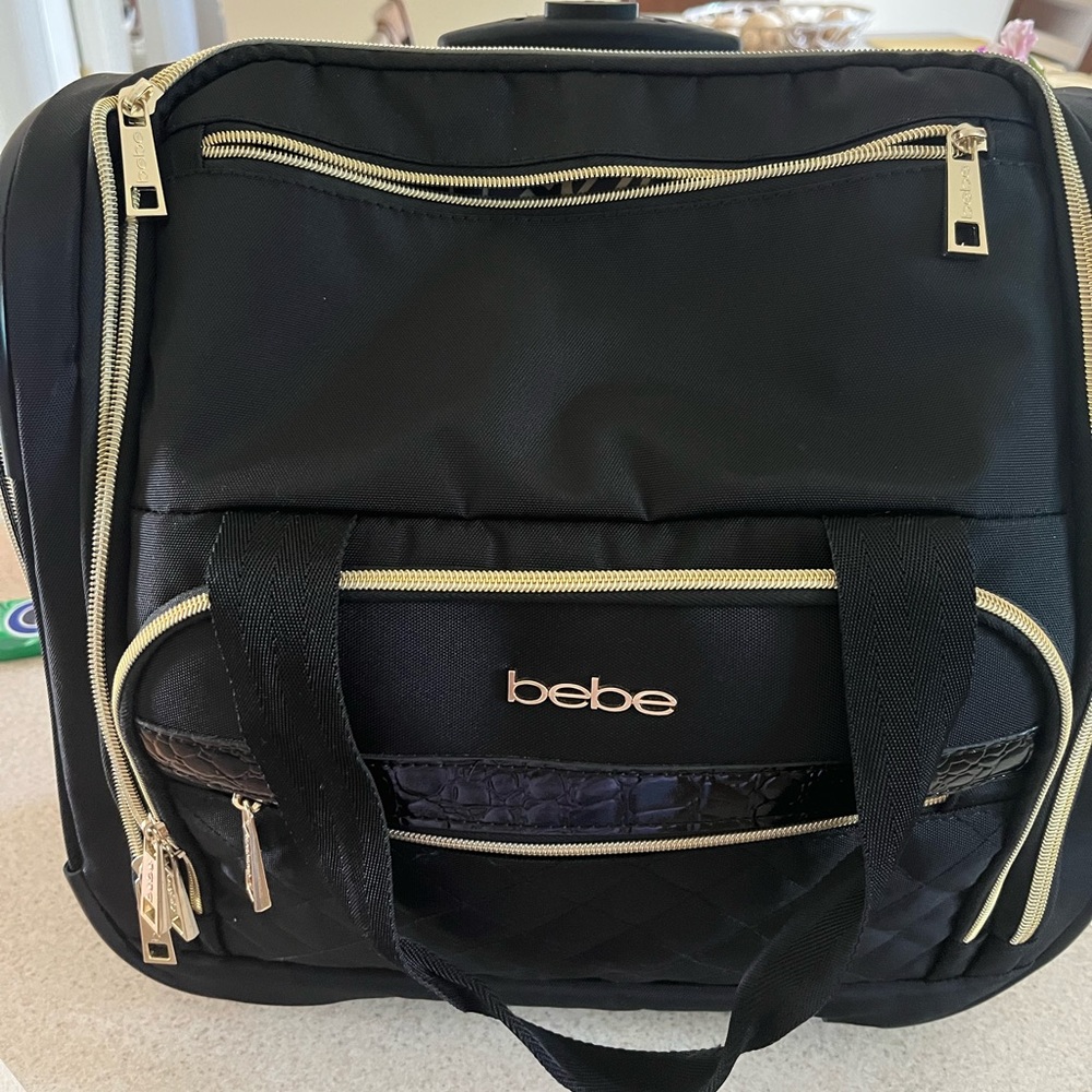 Bebe 15.5 inch soft side rolling under the seat carry on